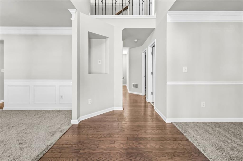 4237 Water Mill Drive Buford, GA 30519 - Photo 4 of 35 wooden floor with white walls