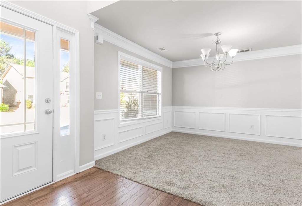 4237 Water Mill Drive Buford, GA 30519 - Photo 5 of 35 wooden floor in an empty room with a window