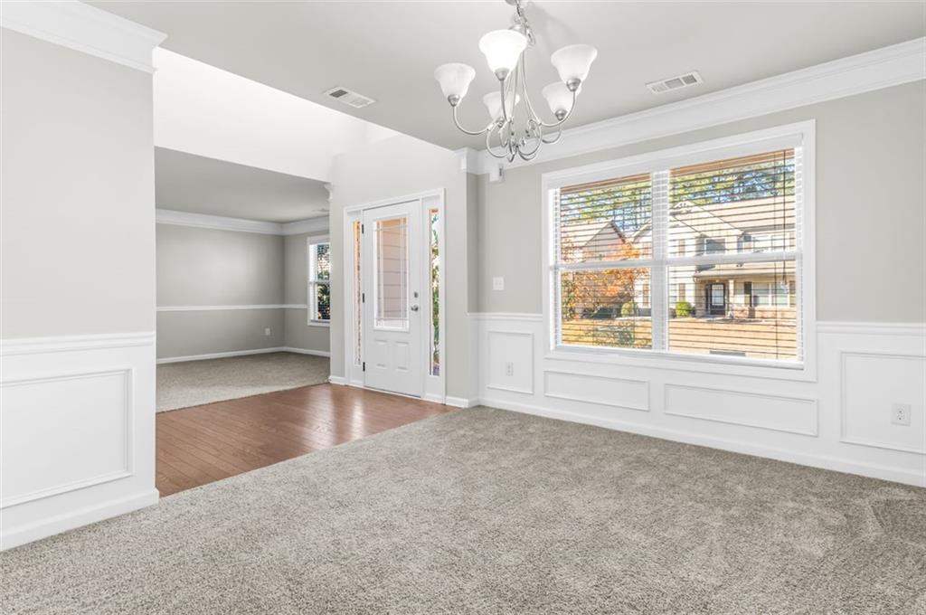 4237 Water Mill Drive Buford, GA 30519 - Photo 8 of 35 wooden floor in an empty room with a window