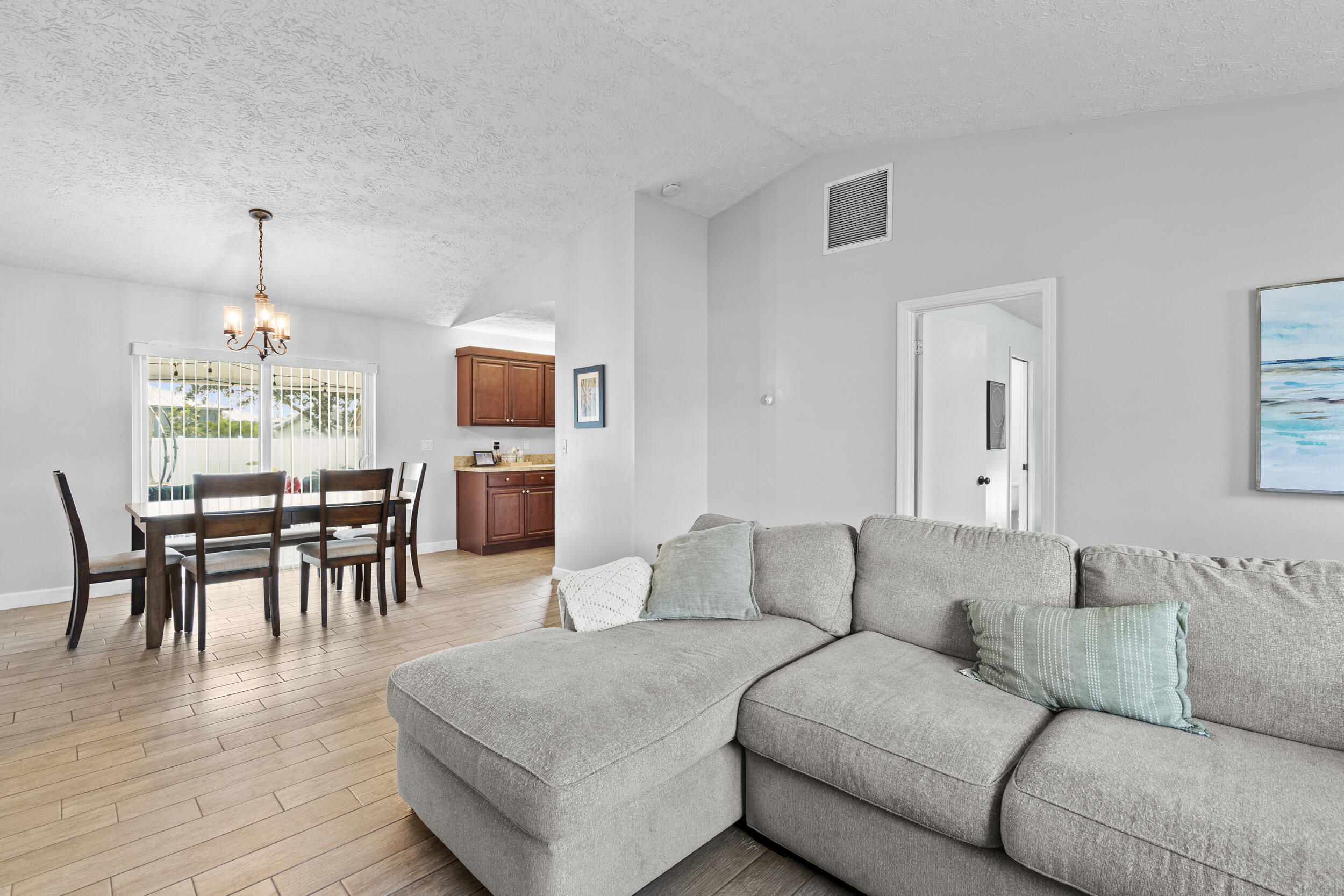 2121 Southeast Midtown Road Port St. Lucie, FL 34952 - Photo 11 of 42 a living room with furniture and a wooden floor
