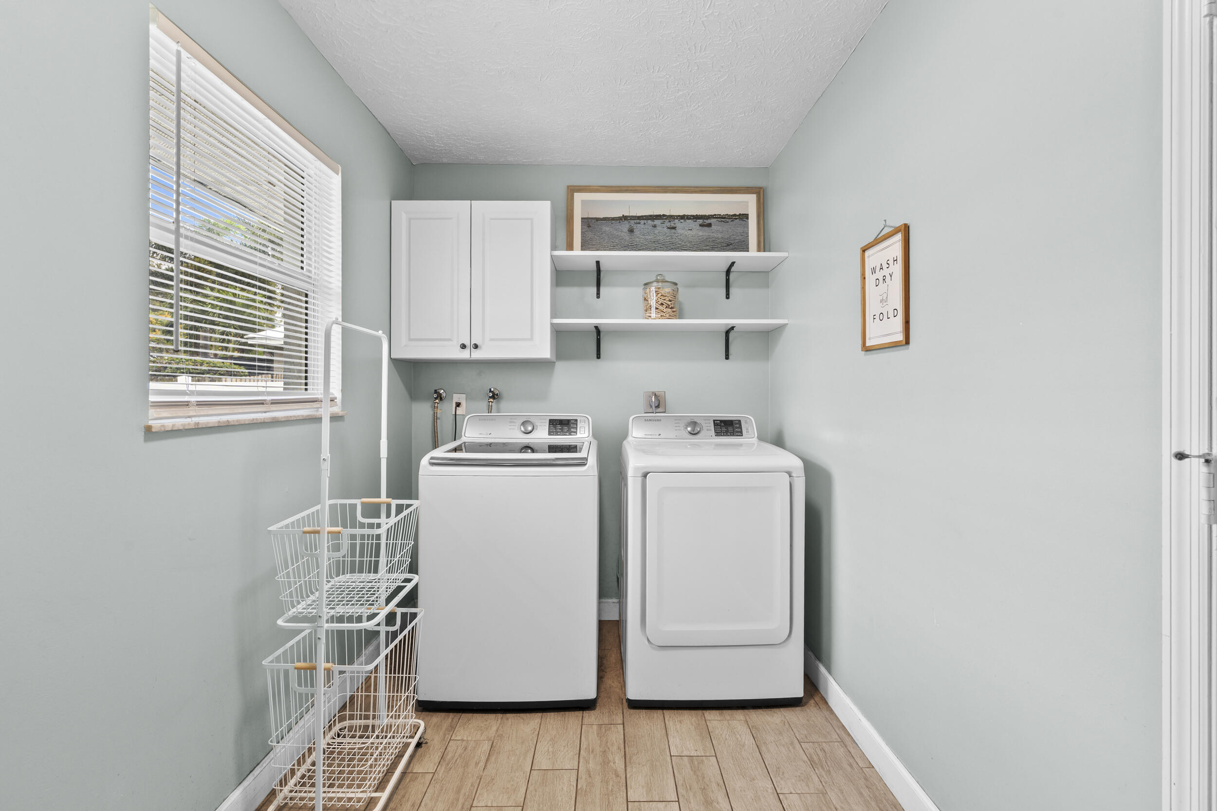 2121 Southeast Midtown Road Port St. Lucie, FL 34952 - Photo 33 of 42 a utility room with dryer and washer
