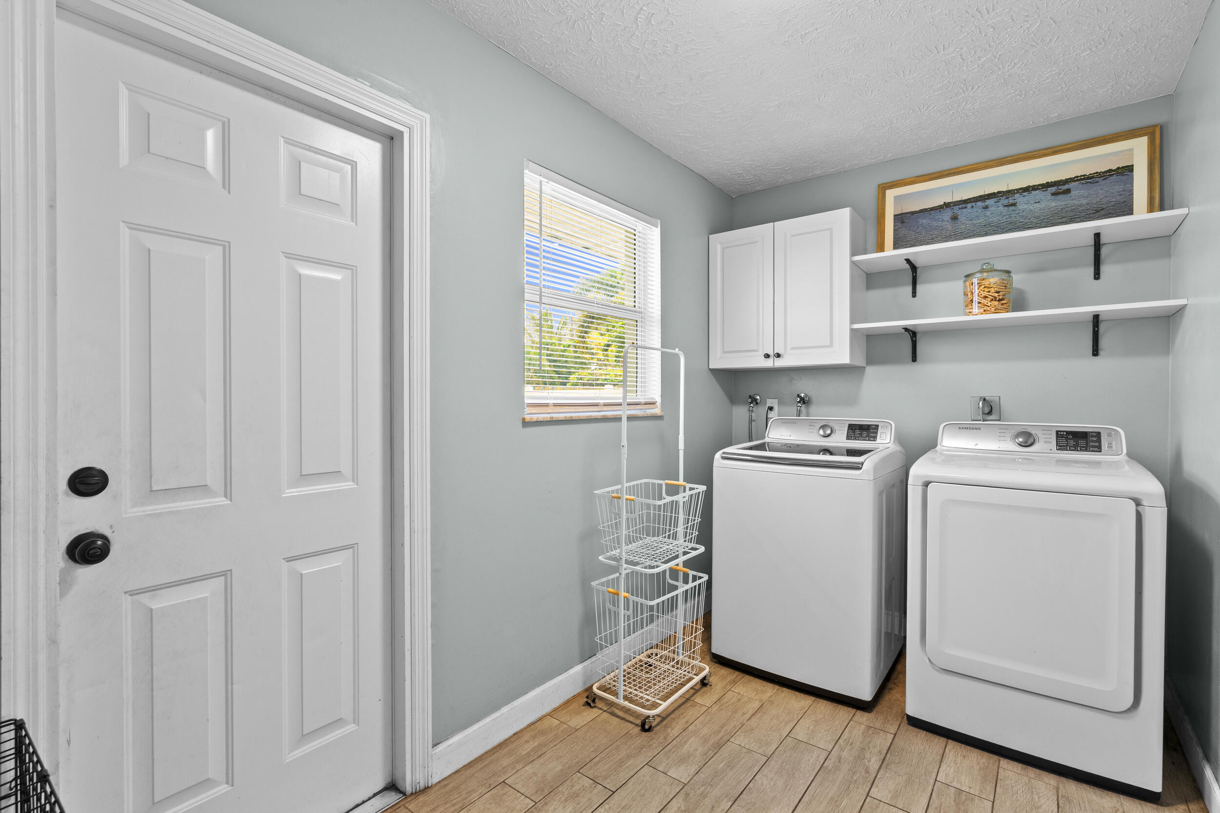 2121 Southeast Midtown Road Port St. Lucie, FL 34952 - Photo 34 of 42 a room with storage and utility