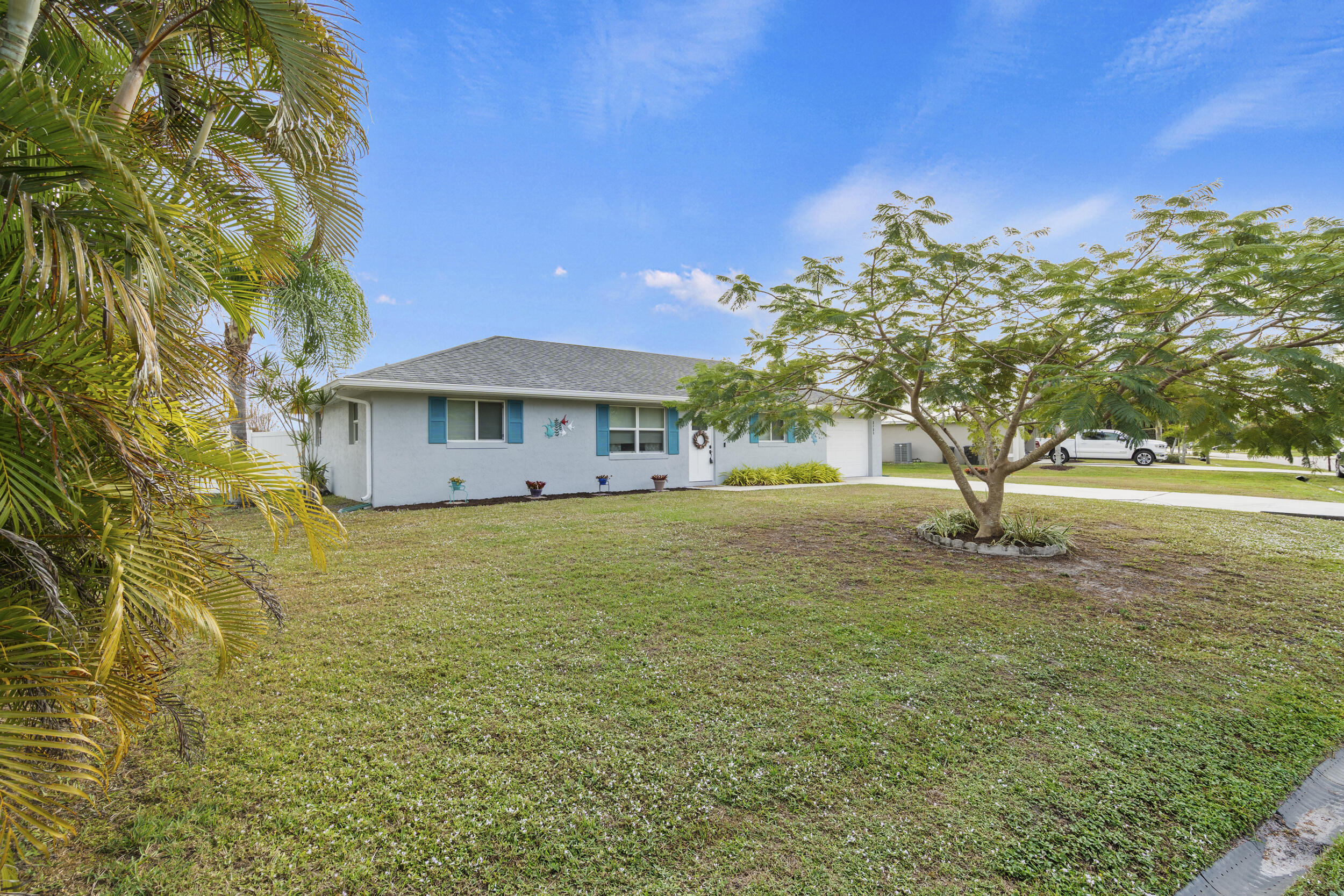 2121 Southeast Midtown Road Port St. Lucie, FL 34952 - Photo 5 of 42 a view of a house with a yard