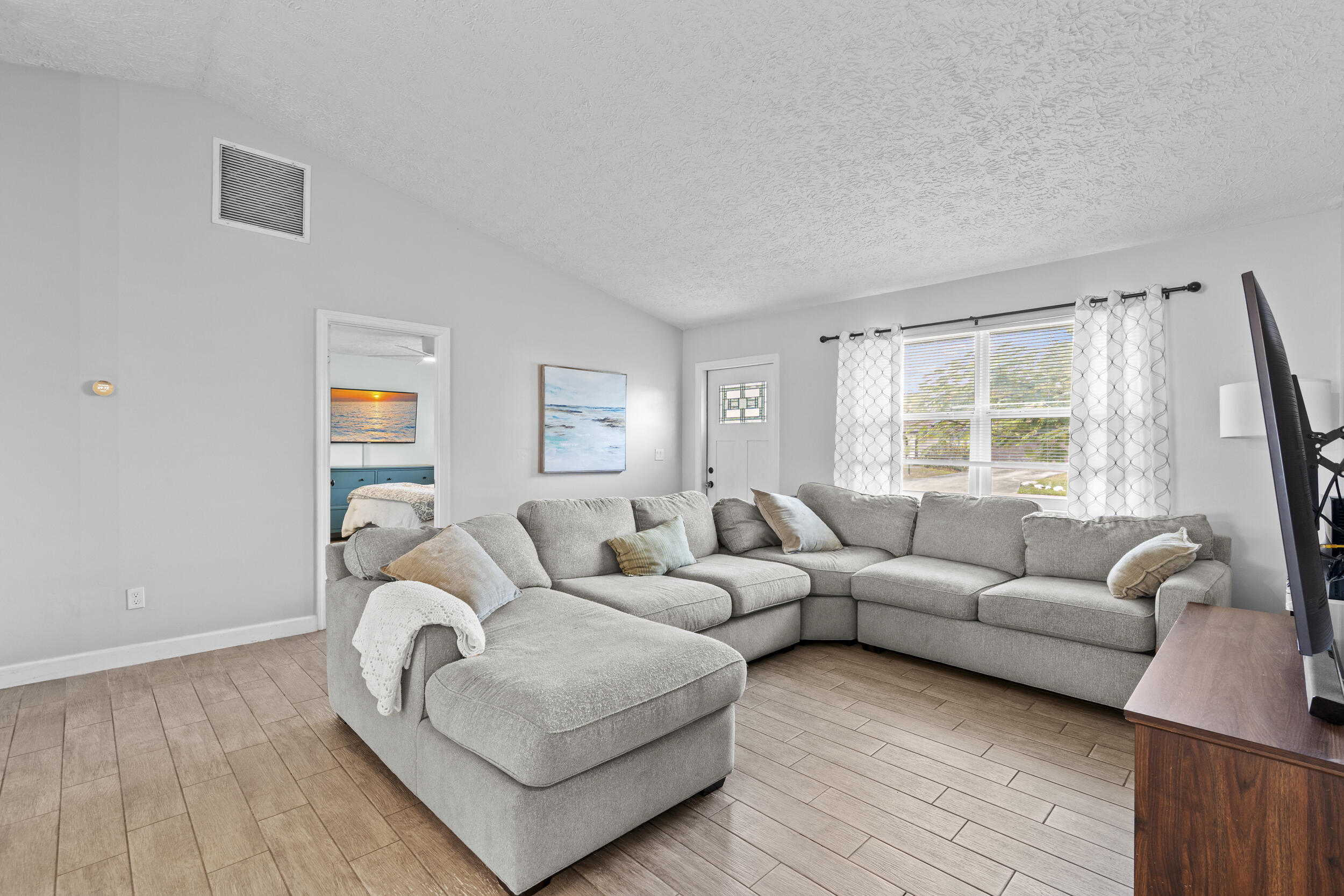 2121 Southeast Midtown Road Port St. Lucie, FL 34952 - Photo 8 of 42 a living room with furniture and a window