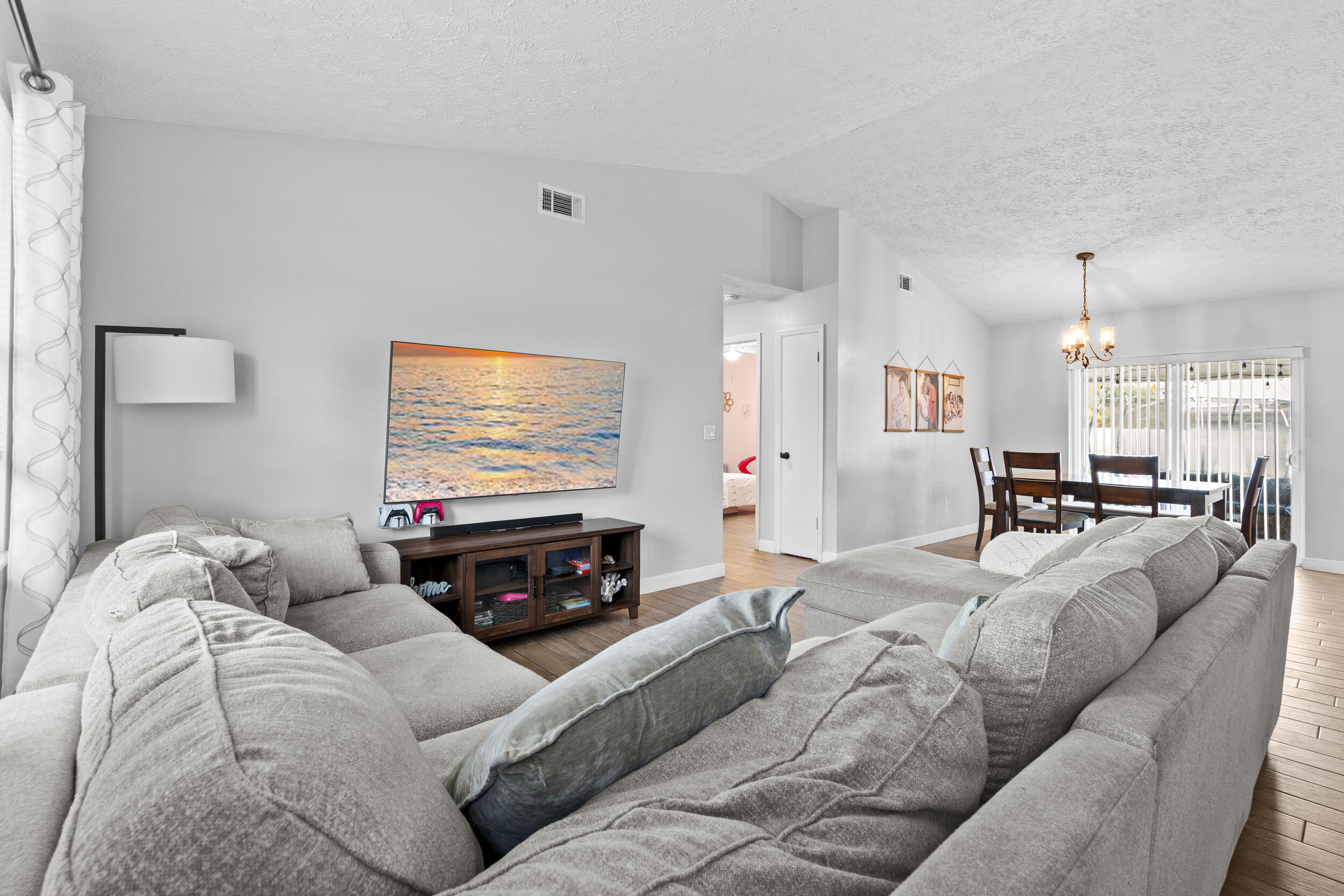 2121 Southeast Midtown Road Port St. Lucie, FL 34952 - Photo 9 of 42 a living room with furniture and a flat screen tv