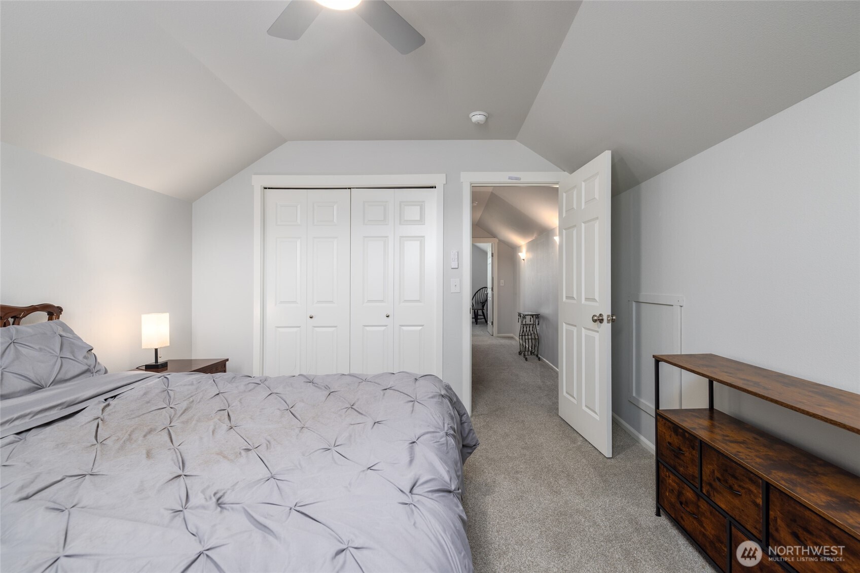 232 Sinclair Alley Mount Vernon, WA 98274 - Photo 19 of 33 a bedroom with a bed and a chandelier