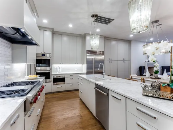 a kitchen with a stove and a sink
