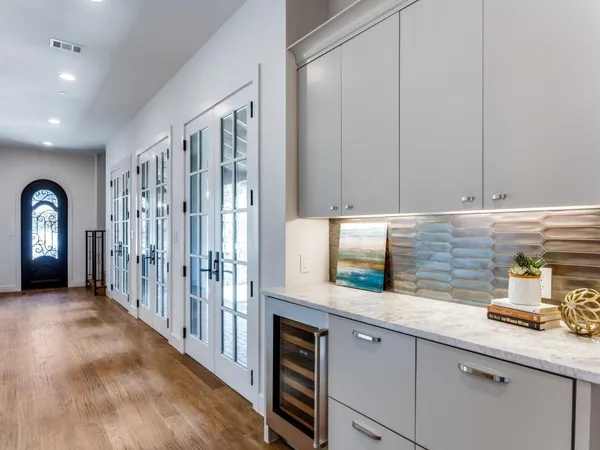 a kitchen with a refrigerator and sink