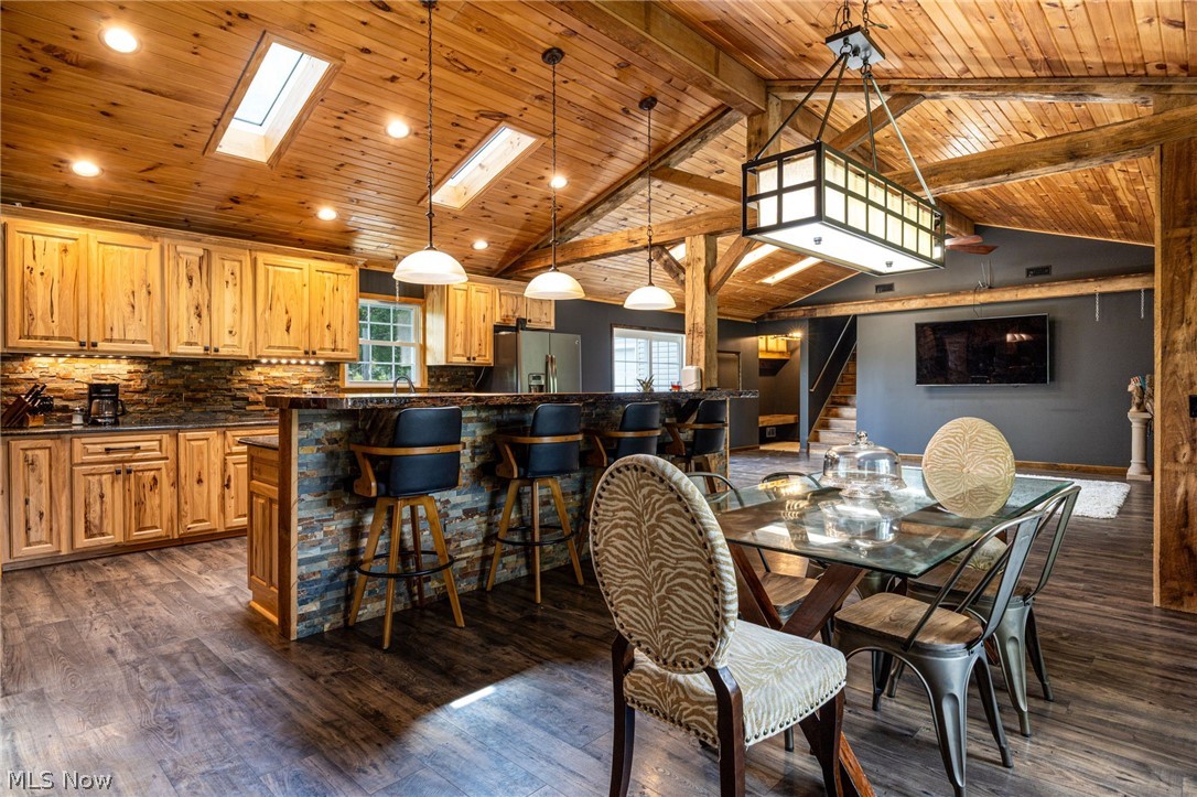 7996 Buffham Road Lodi, OH 44254 - Photo 20 of 40 Vaulted wood-paneled ceiling with skylights and exposed beams