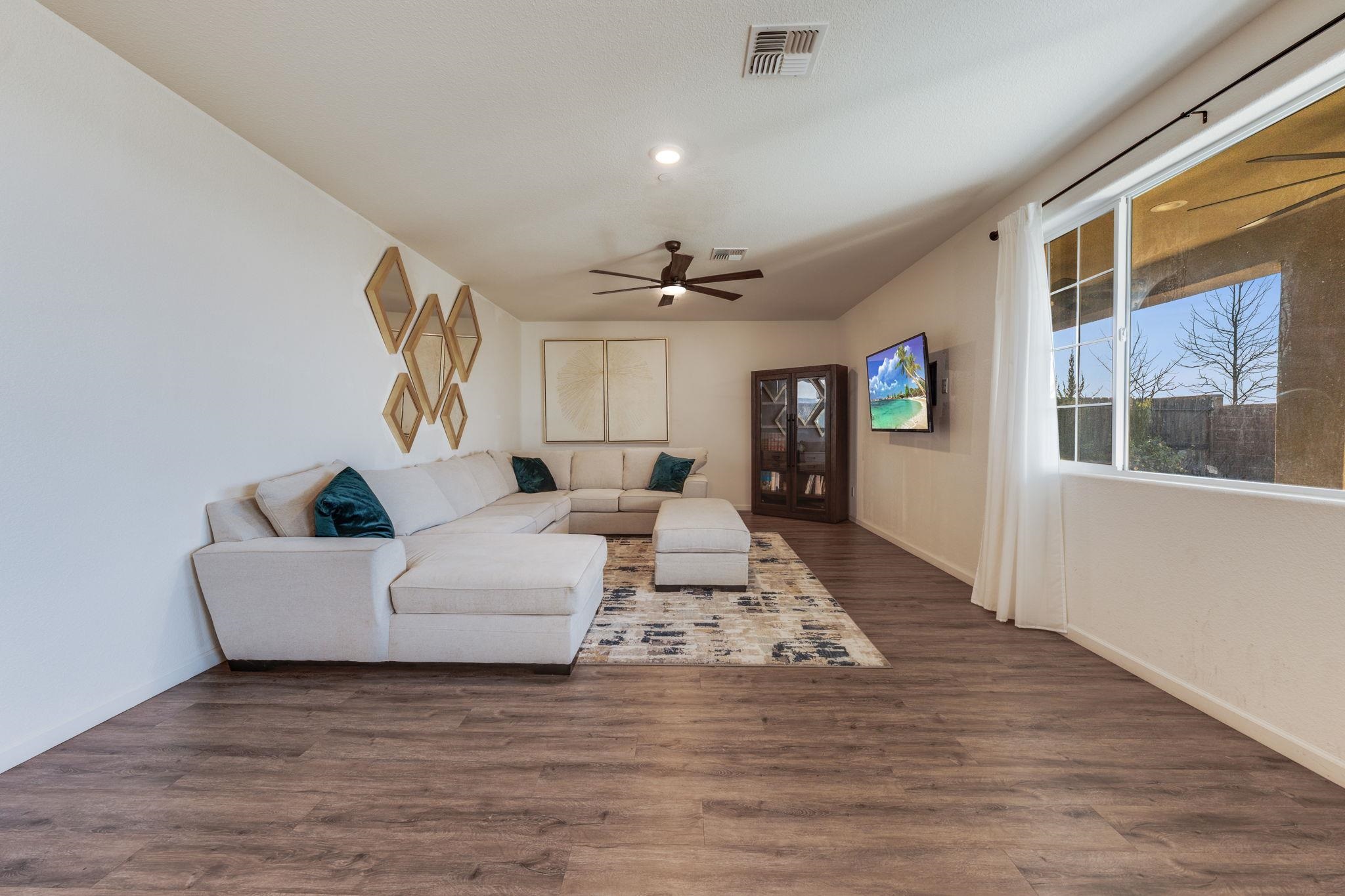 1305 Stark Bridge Road Lincoln, CA 95648 - Photo 14 of 53 a living room with furniture and a chandelier
