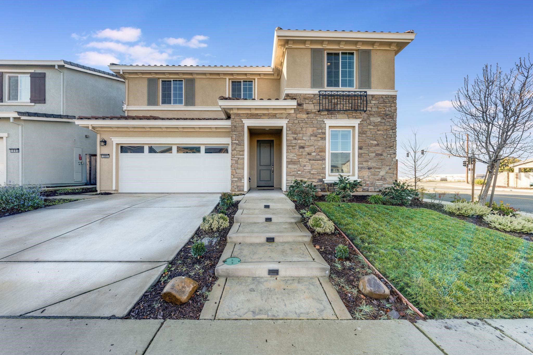 1305 Stark Bridge Road Lincoln, CA 95648 - Photo 2 of 53 a front view of a house with a yard