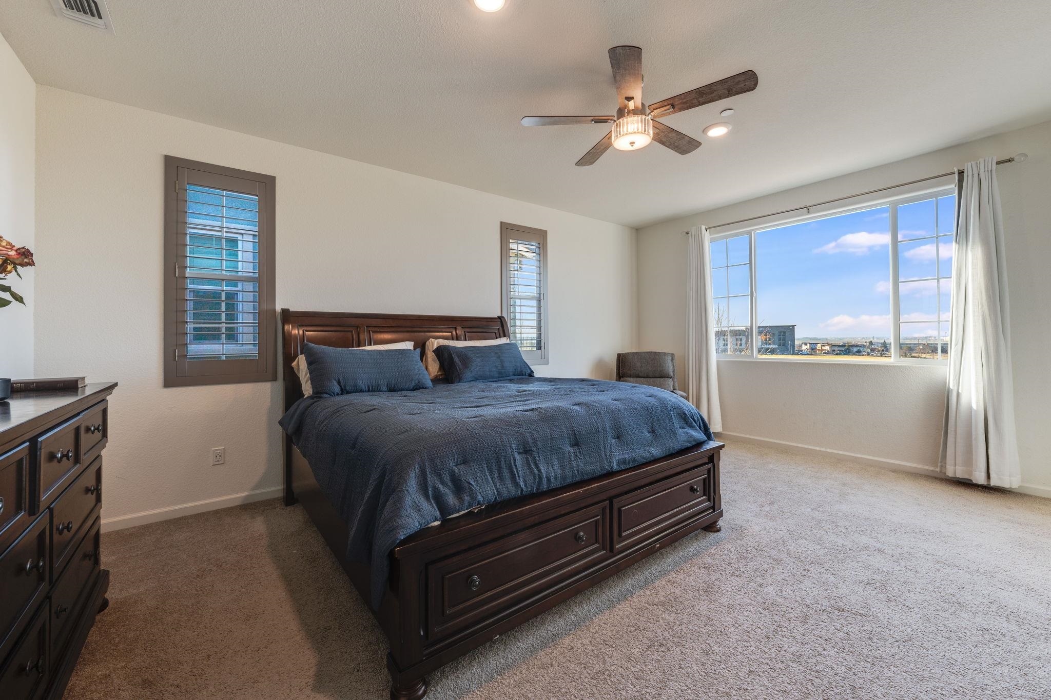1305 Stark Bridge Road Lincoln, CA 95648 - Photo 23 of 53 a bedroom with a large bed and a ceiling fan