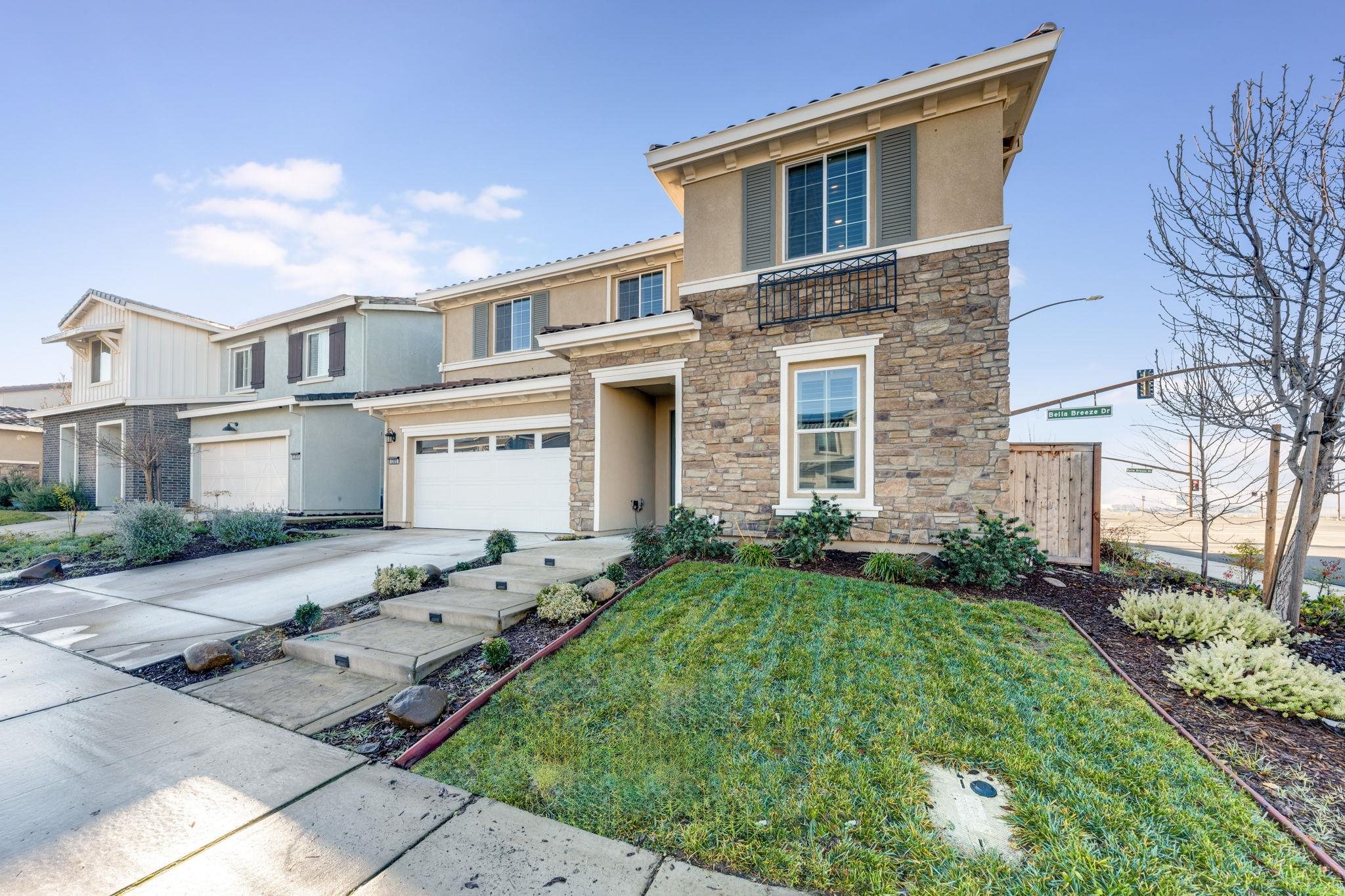 1305 Stark Bridge Road Lincoln, CA 95648 - Photo 3 of 53 a front view of a house with a garden