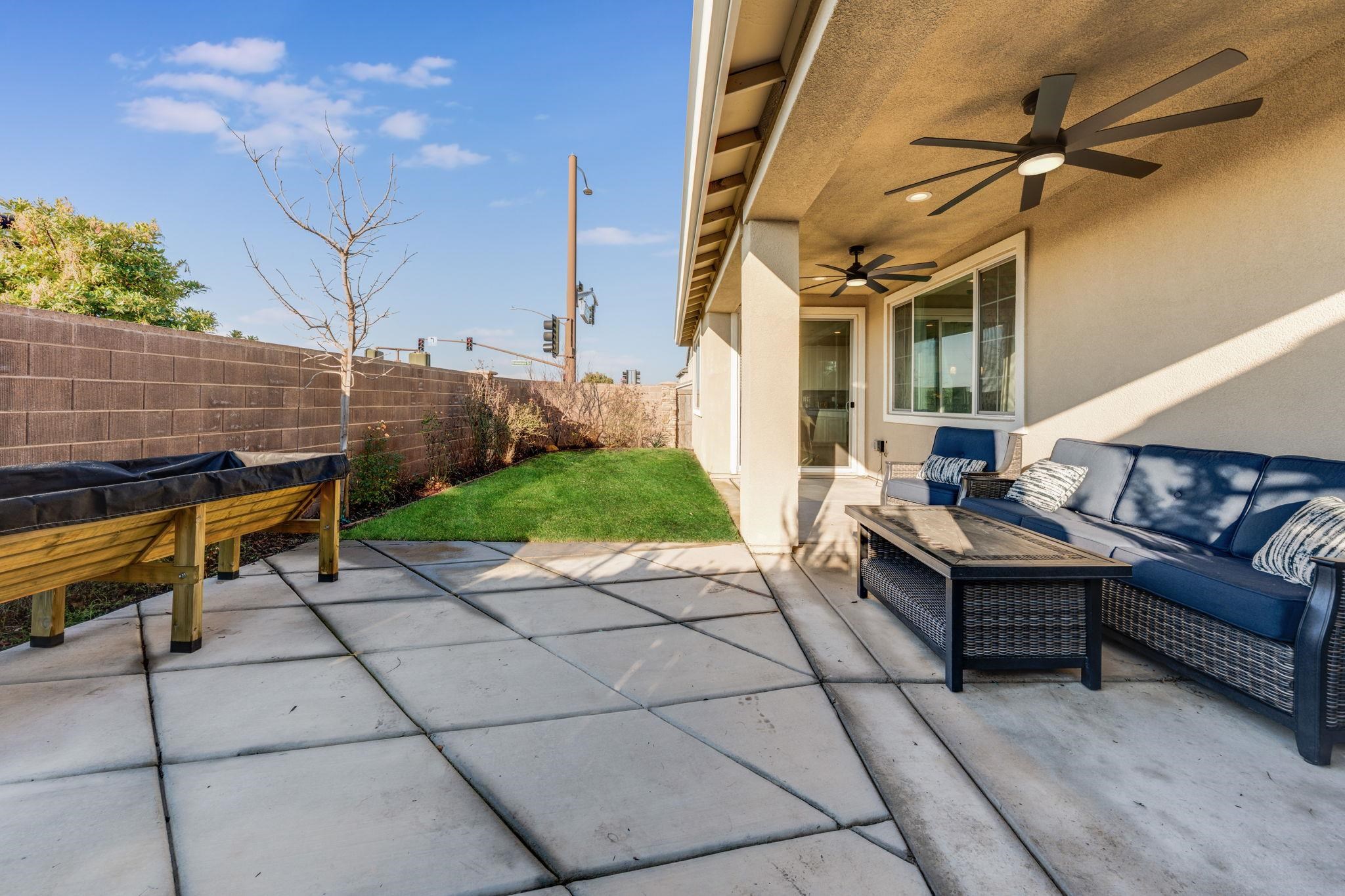 1305 Stark Bridge Road Lincoln, CA 95648 - Photo 52 of 53 a view of a terrace with couches and table with wooden floor