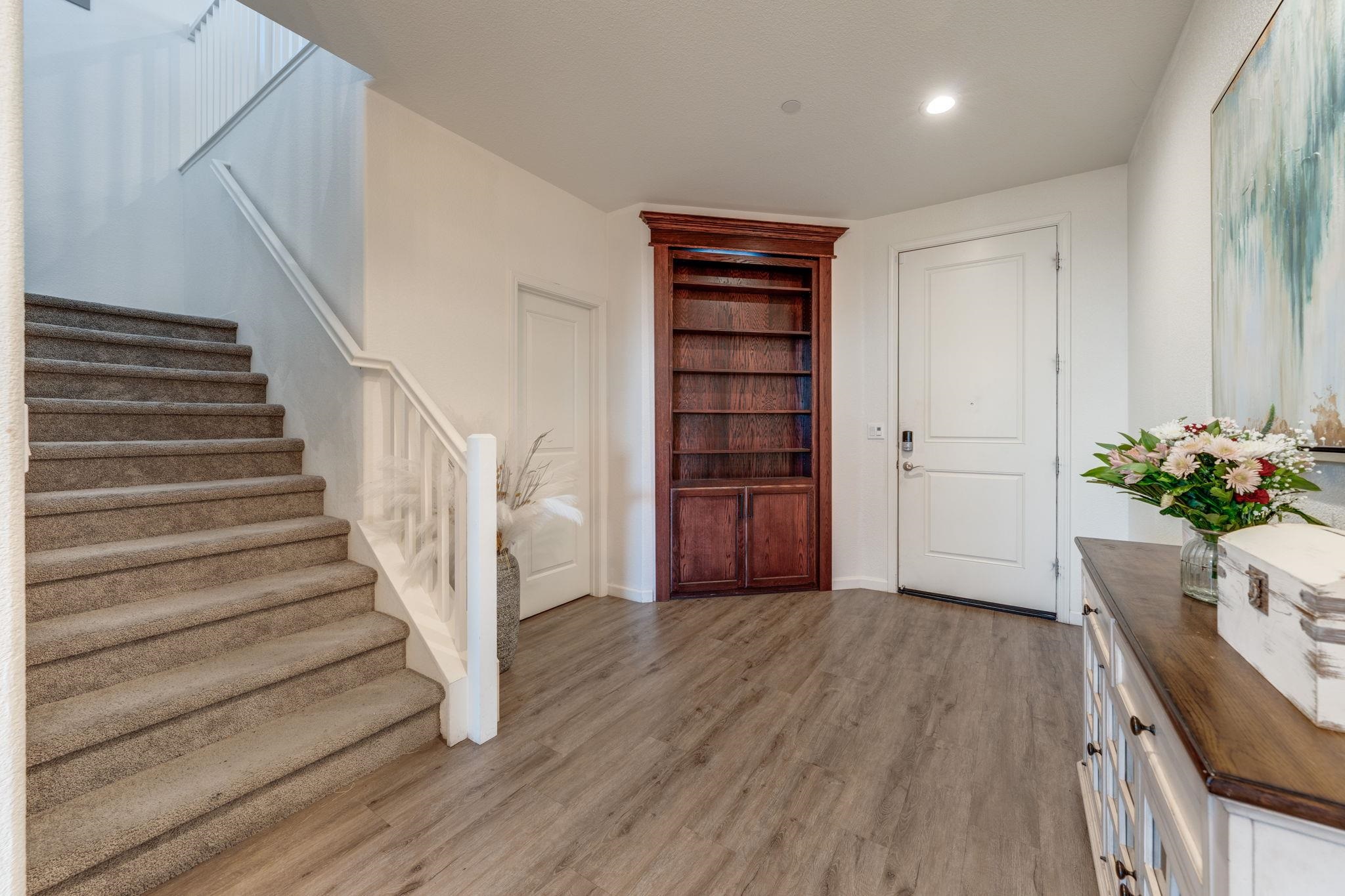 1305 Stark Bridge Road Lincoln, CA 95648 - Photo 6 of 53 a view of a hallway with wooden floor and stairs