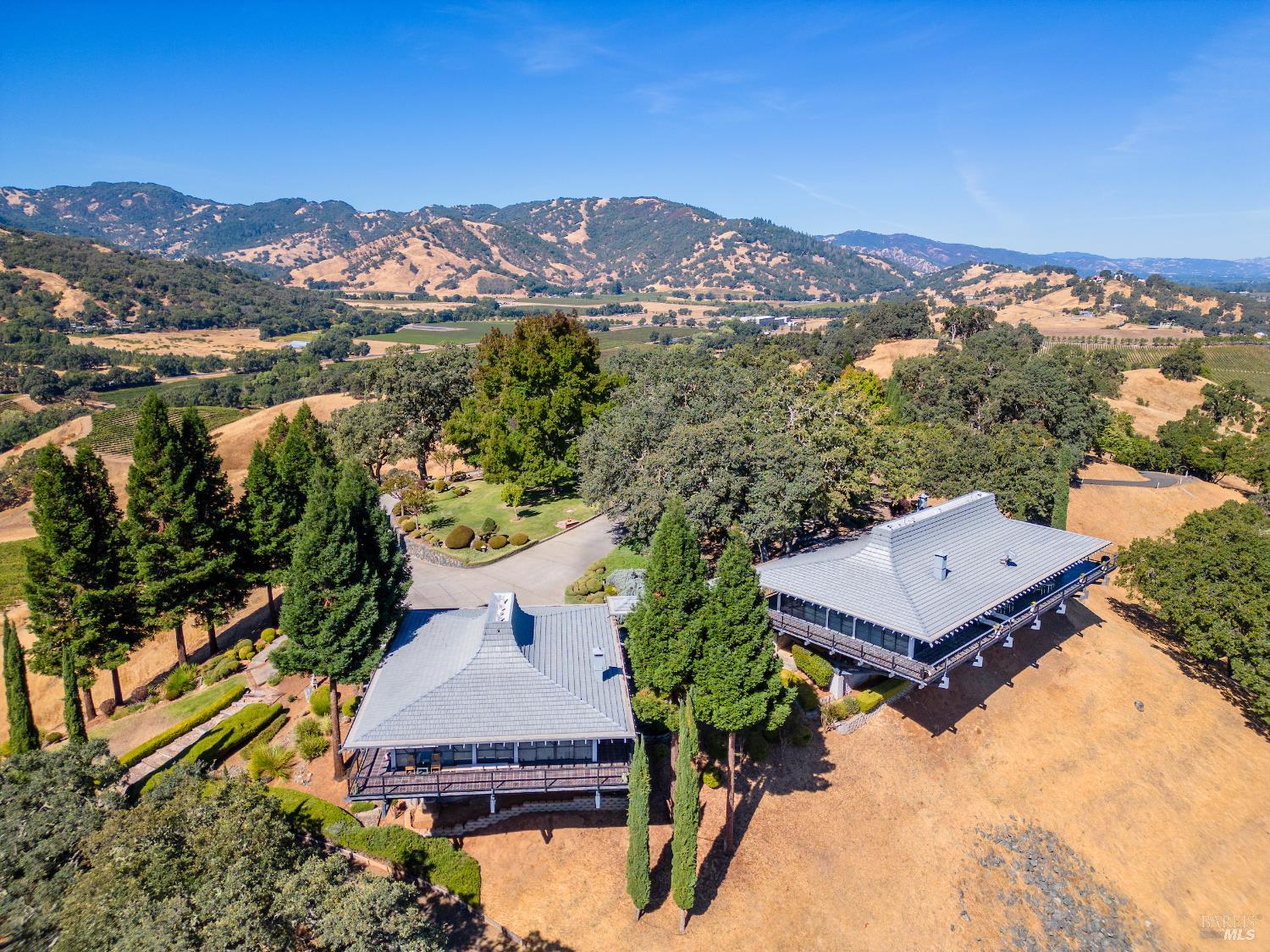 241 Henry Station Road Ukiah, CA 95482 - Photo 2 of 76 an aerial view of a house with a yard and mountain view