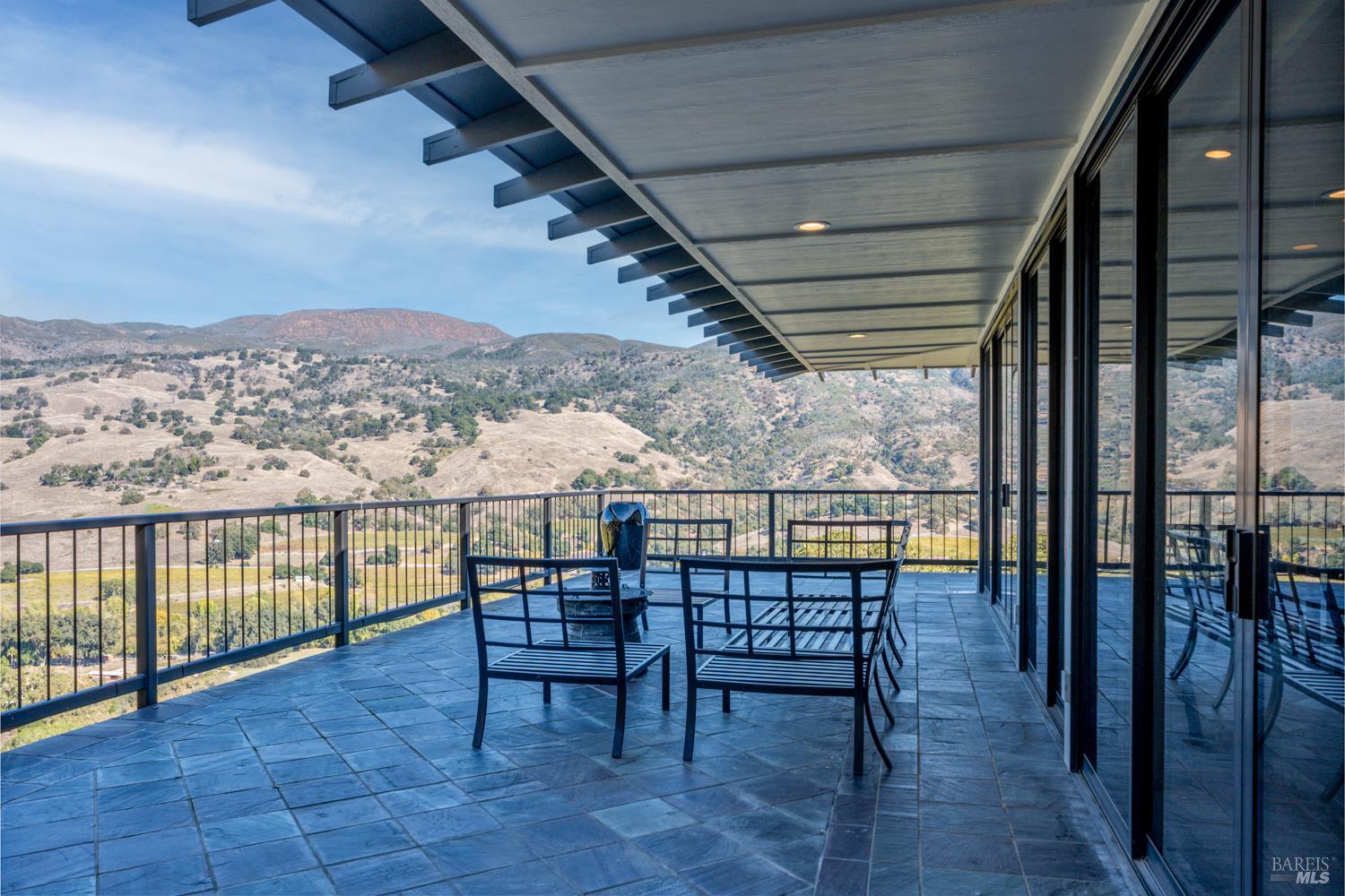 241 Henry Station Road Ukiah, CA 95482 - Photo 22 of 76 a view of a balcony with chairs and wooden floor