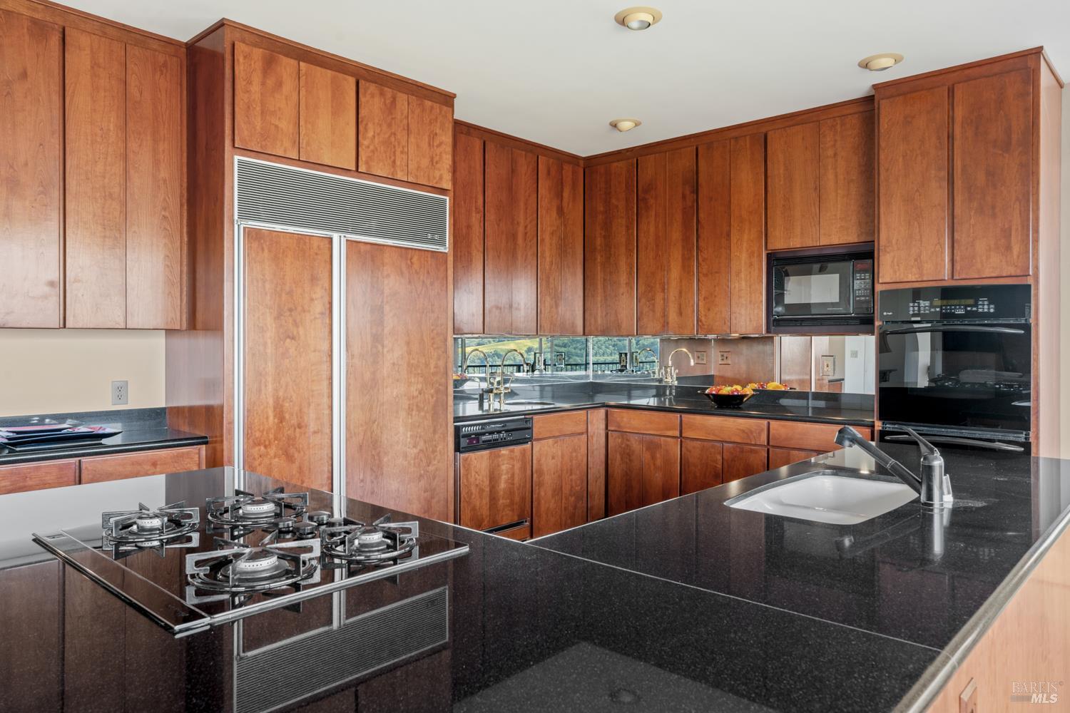 241 Henry Station Road Ukiah, CA 95482 - Photo 33 of 76 a kitchen with stainless steel appliances a stove a sink dishwasher and cabinets with wooden floor