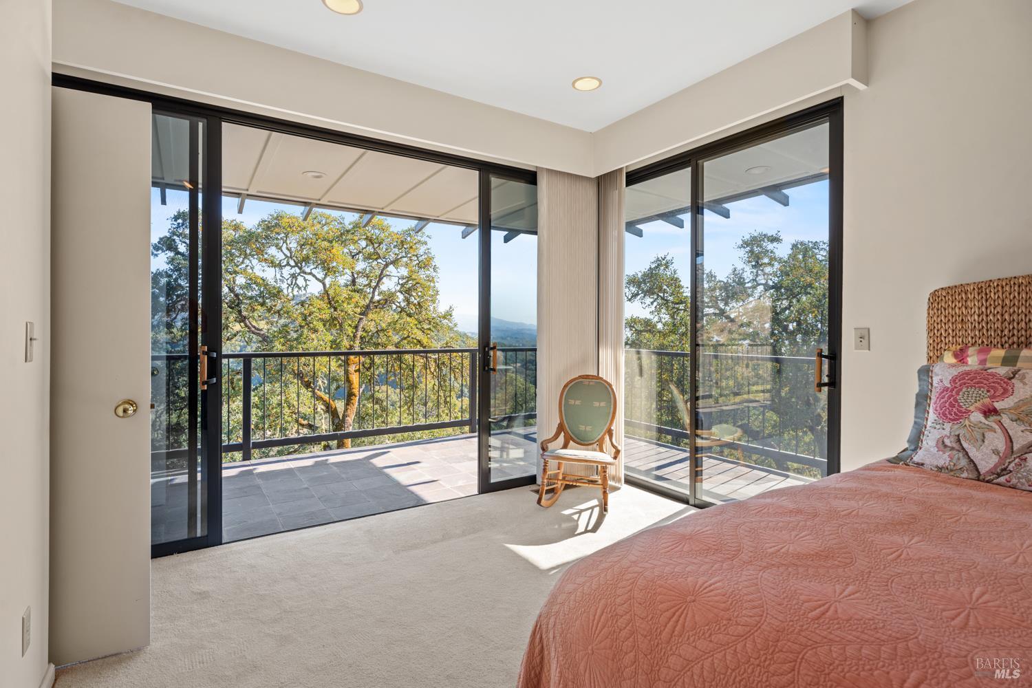 241 Henry Station Road Ukiah, CA 95482 - Photo 61 of 76 a bedroom with a bed and a lamp next to a large window