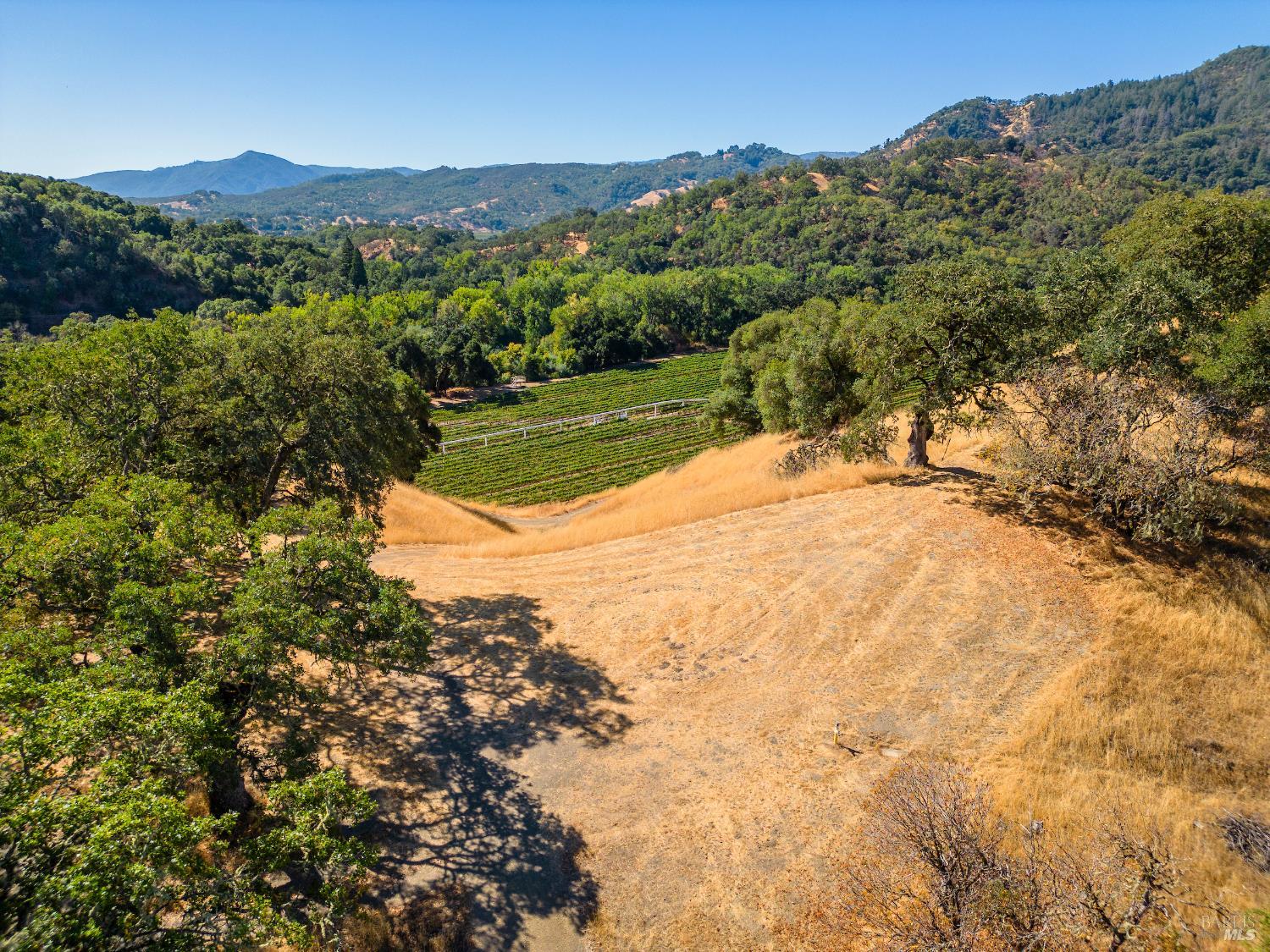 241 Henry Station Road Ukiah, CA 95482 - Photo 76 of 76 a view of a lake with a mountain in the background