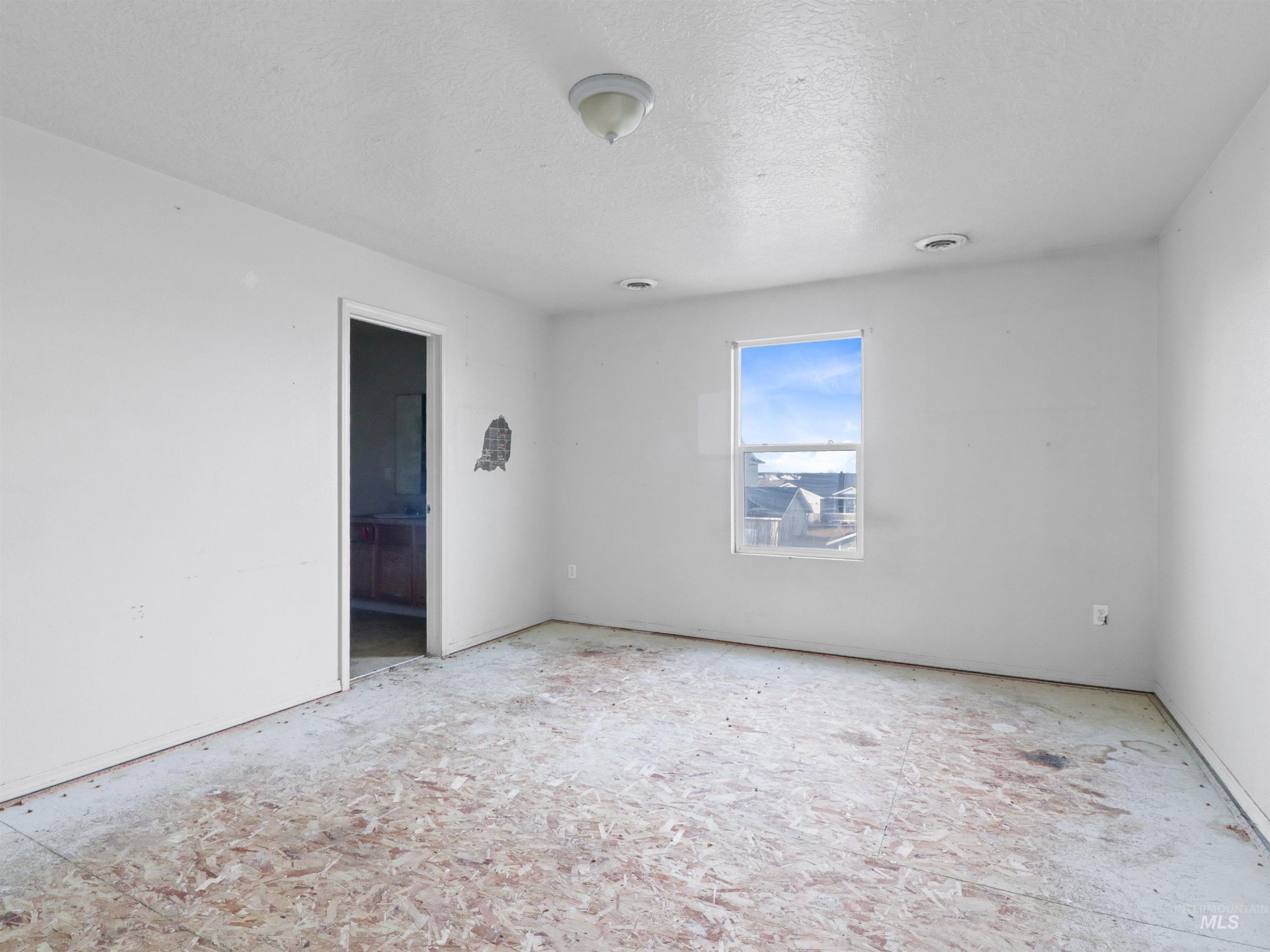 4415 Duke Street Caldwell, ID 83607 - Photo 15 of 22 Unfurnished room with a textured ceiling