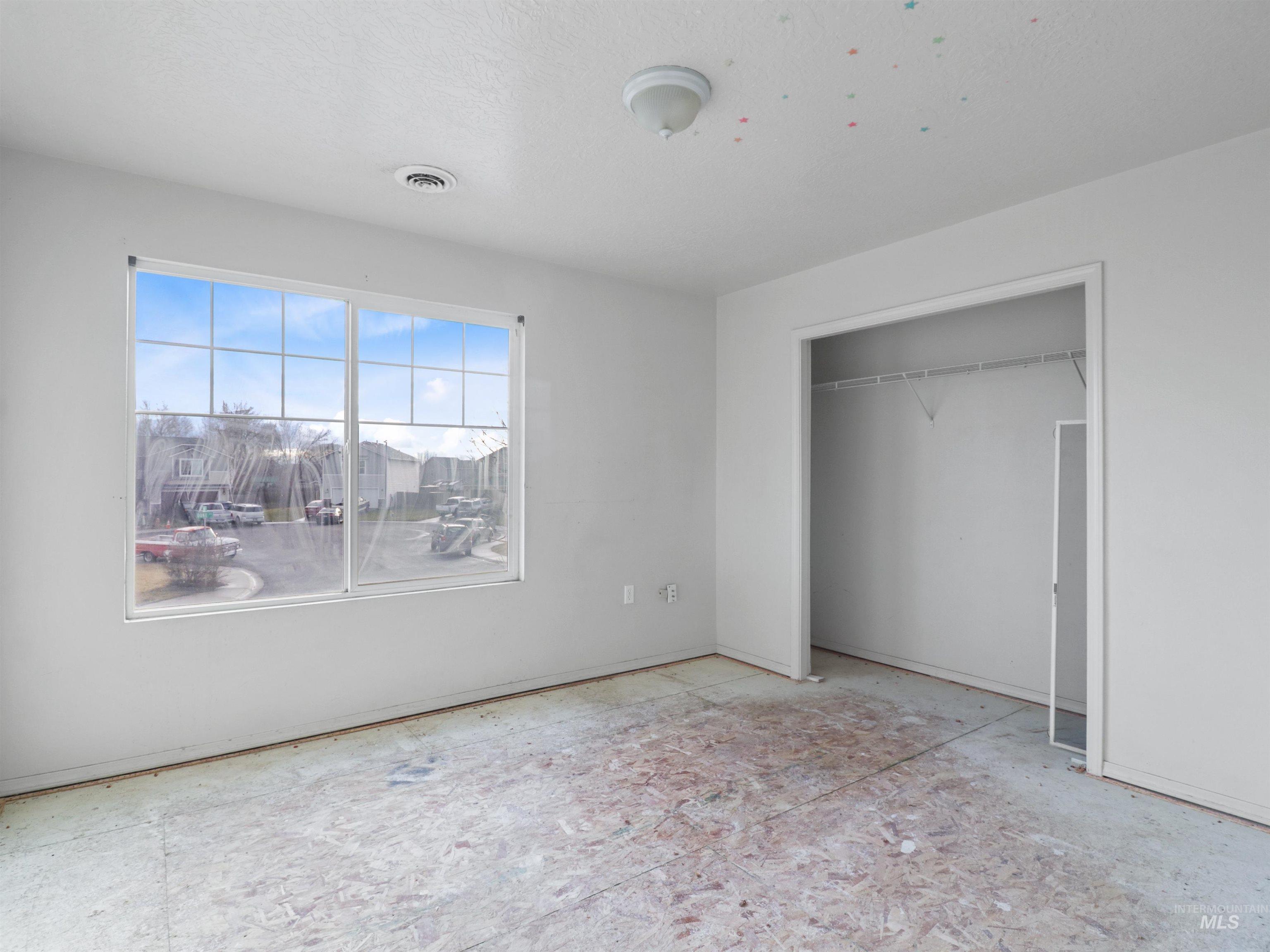 4415 Duke Street Caldwell, ID 83607 - Photo 19 of 22 Unfurnished bedroom with a closet