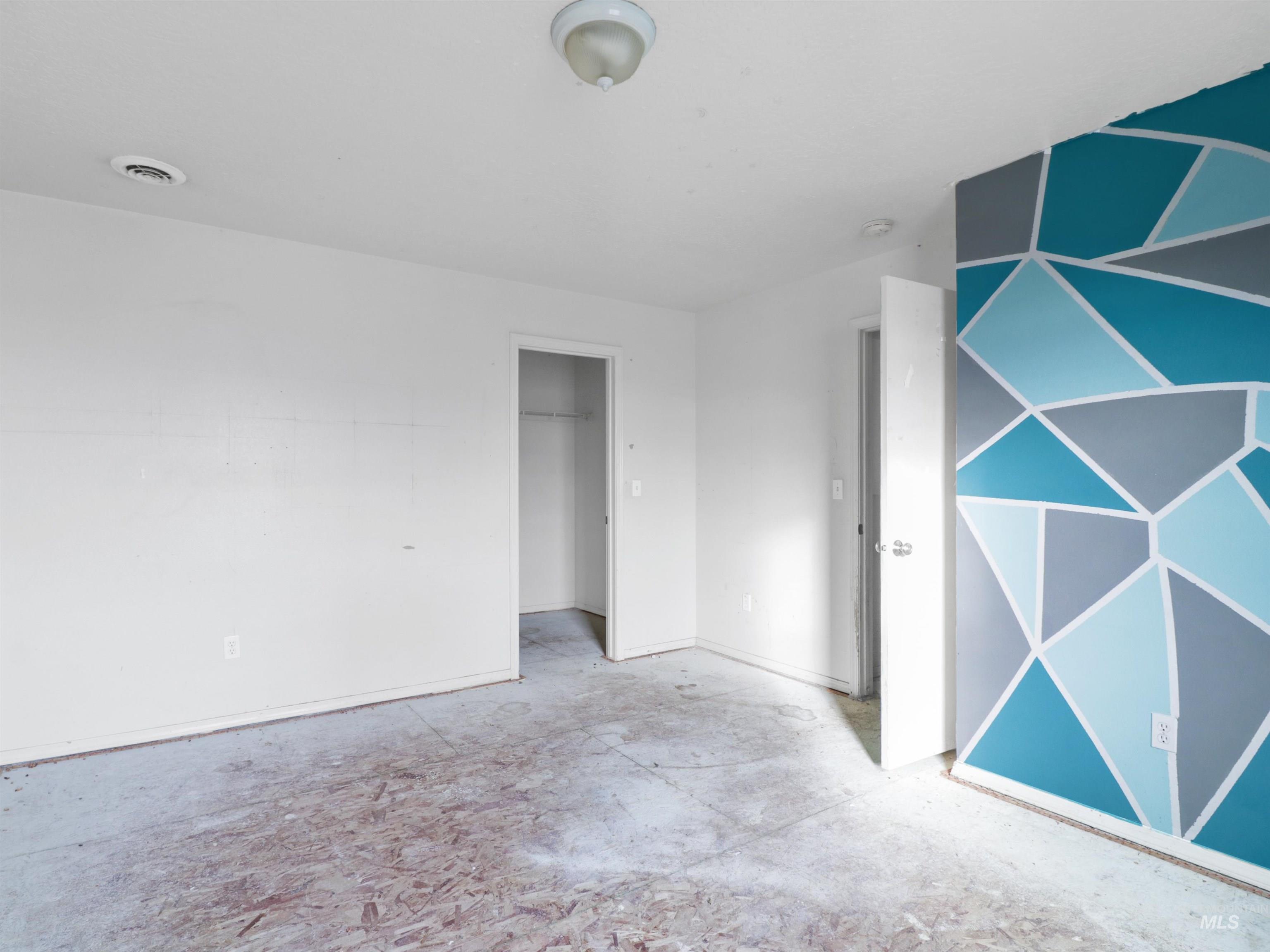 4415 Duke Street Caldwell, ID 83607 - Photo 21 of 22 Unfurnished bedroom featuring a closet and unfinished concrete floors