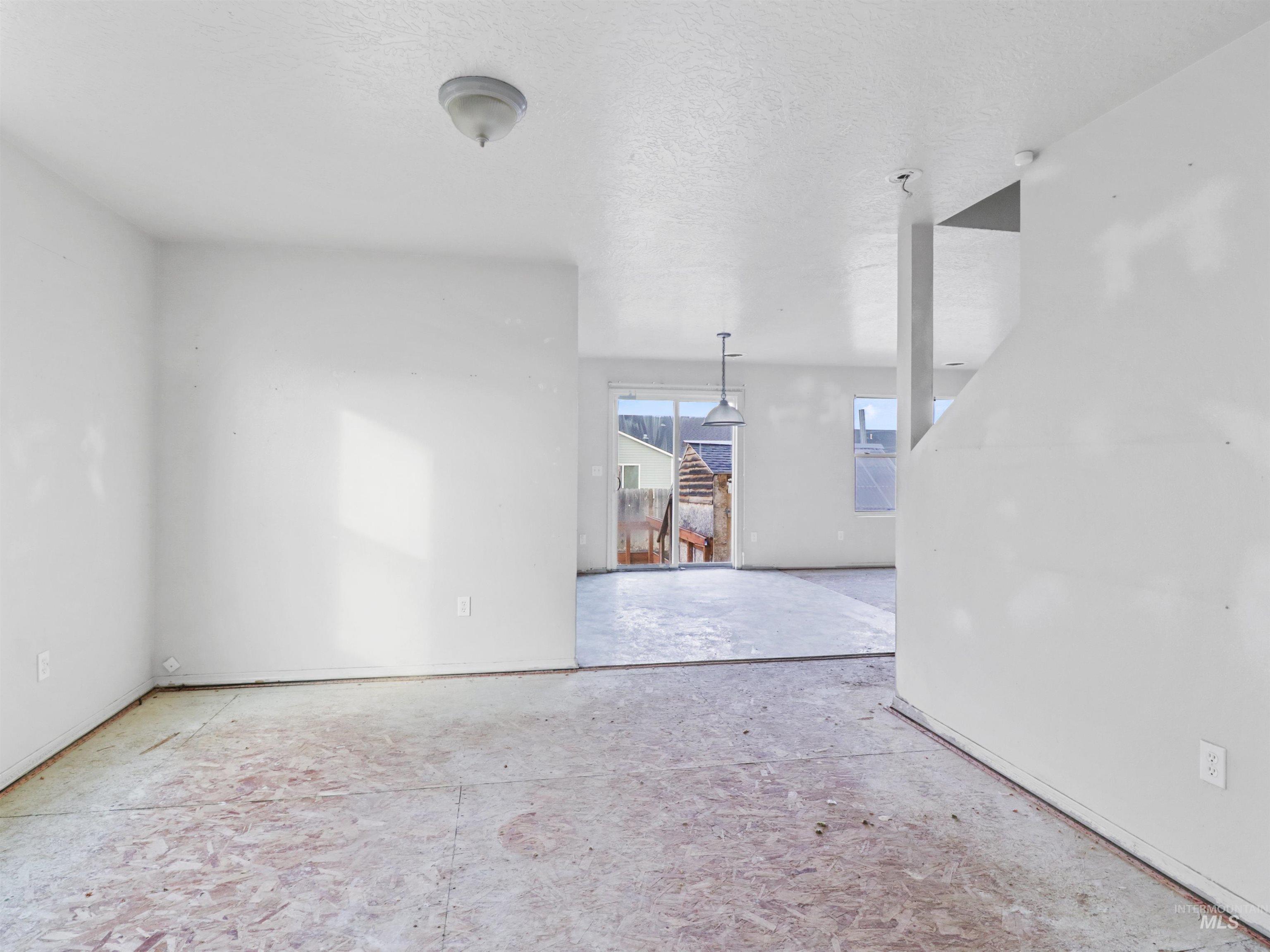 4415 Duke Street Caldwell, ID 83607 - Photo 9 of 22 Empty room with a textured ceiling