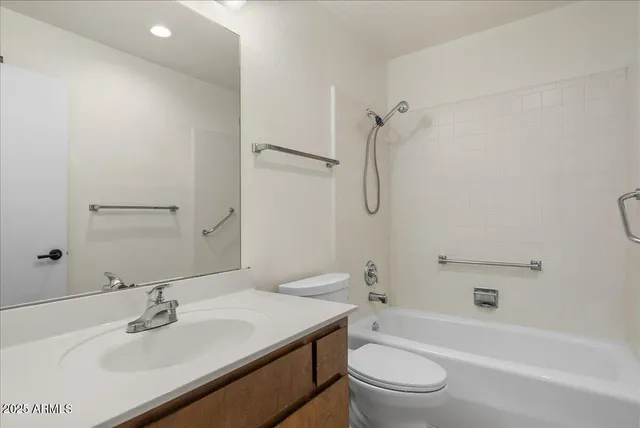 a view of a room with wooden floor and white walls