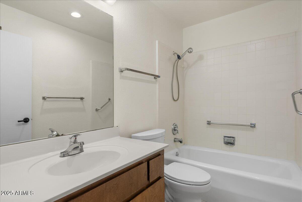 6438 East Butte Street, Unit 3 Mesa, AZ 85205 - Photo 15 of 24 a bathroom with a sink toilet and shower