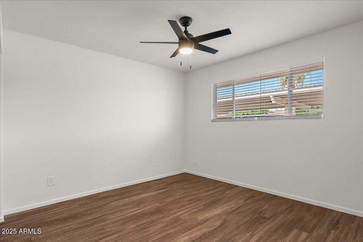 6438 East Butte Street, Unit 3 Mesa, AZ 85205 - Photo 16 of 24 a view of a big room with wooden floor and windows