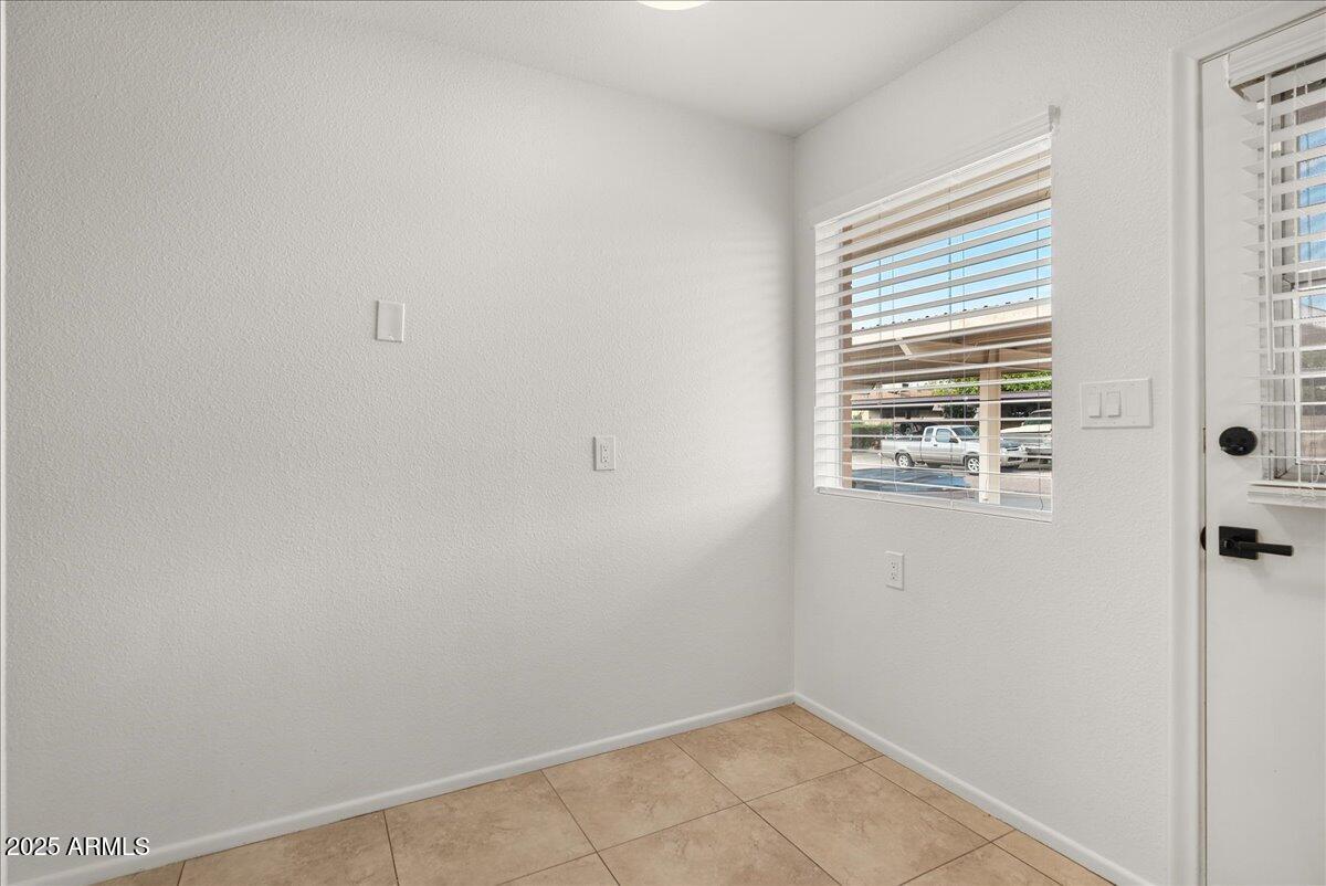6438 East Butte Street, Unit 3 Mesa, AZ 85205 - Photo 8 of 24 a view of a room that has a window in it