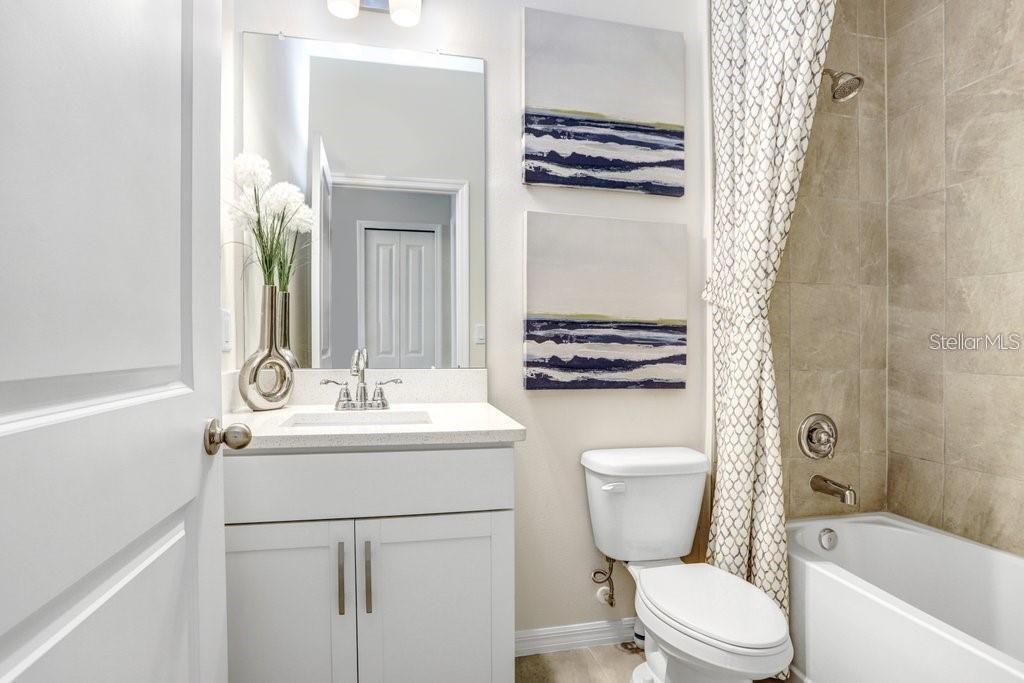 5341 Coldpine Place Seffner, FL 33584 - Photo 11 of 24 a bathroom with a sink toilet and shower