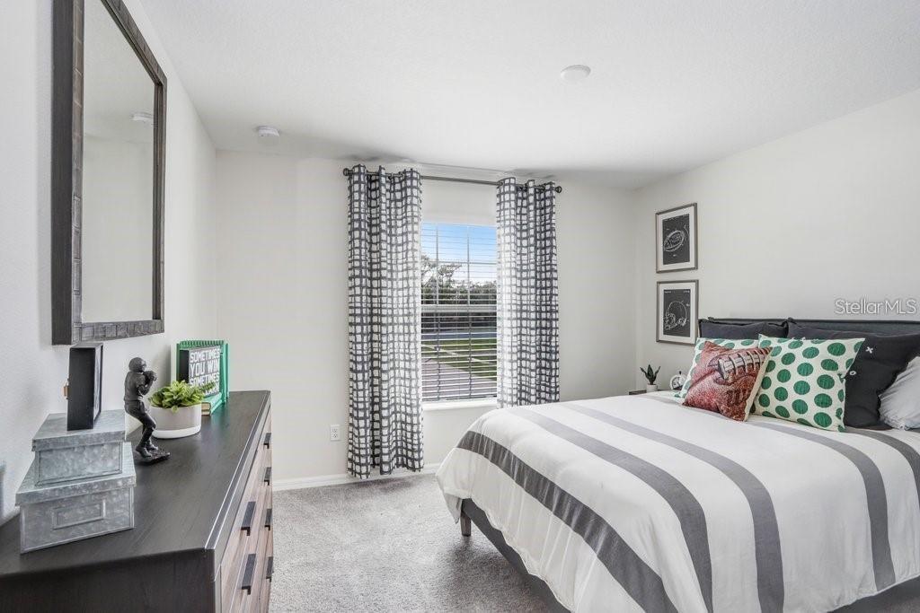 5341 Coldpine Place Seffner, FL 33584 - Photo 19 of 24 a bedroom with a bed and a window