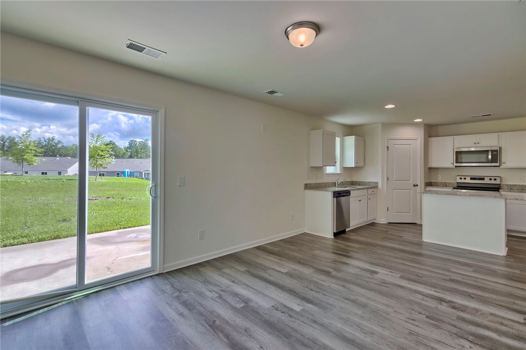 245 Wimbledon Way Murrells Inlet, SC 29576 - Photo 14 of 29 LIVING ROOM INTO KITCHEN