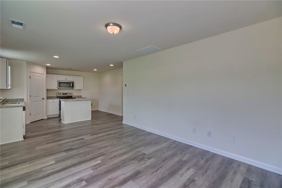 245 Wimbledon Way Murrells Inlet, SC 29576 - Photo 15 of 29 LIVING ROOM INTO KITCHEN