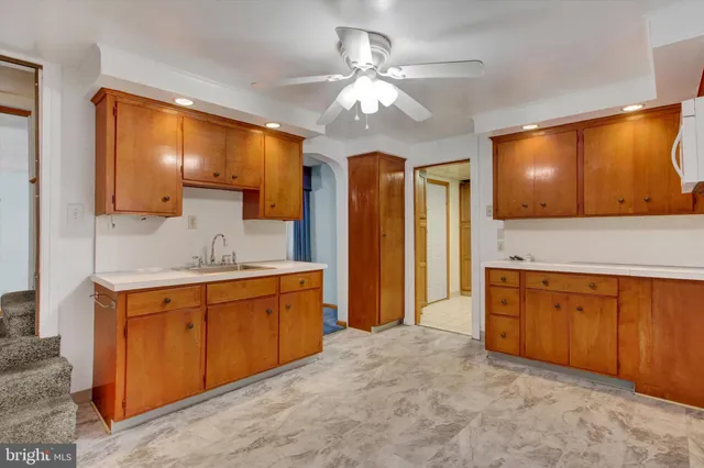 a spacious bathroom with a sink a mirror and a bathtub