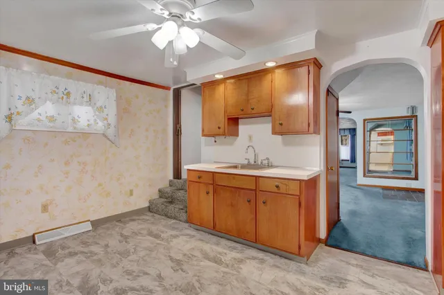 a bathroom with a sink a mirror and a shower