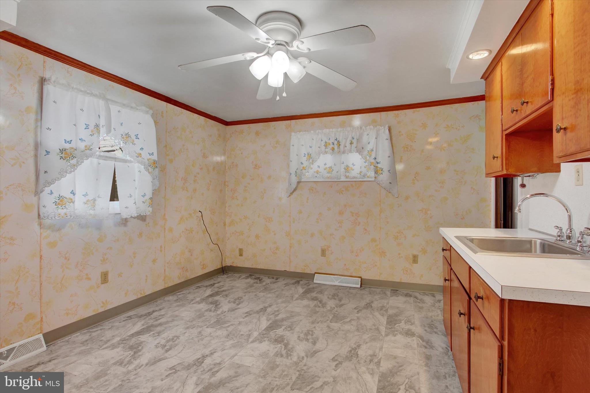 22 Cemetery Street Littlestown, PA 17340 - Photo 13 of 34 a bathroom with a sink a mirror and a shower