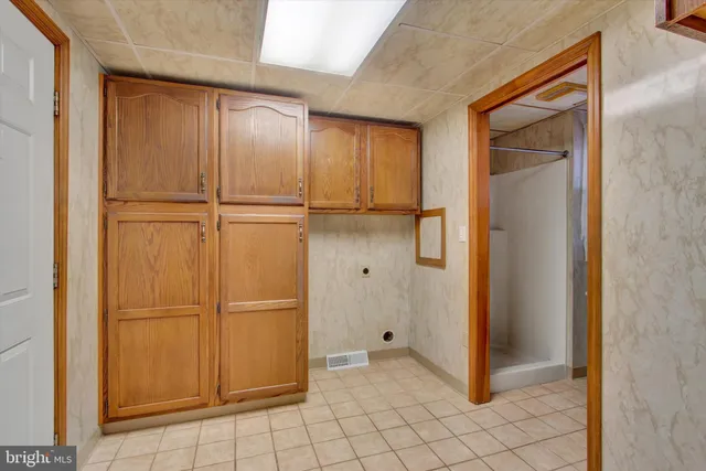 a bathroom with a shower and a sink