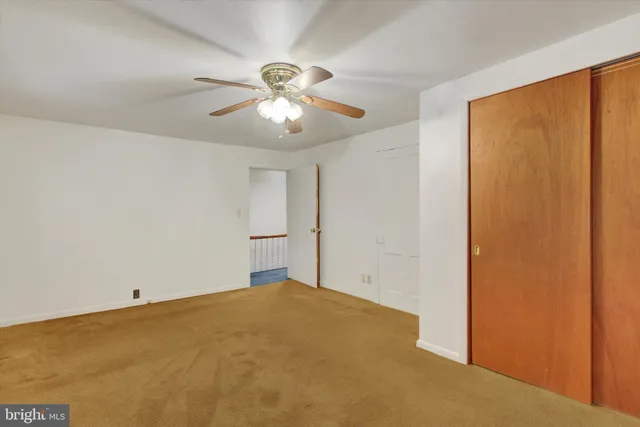 a view of a livingroom with a ceiling fan