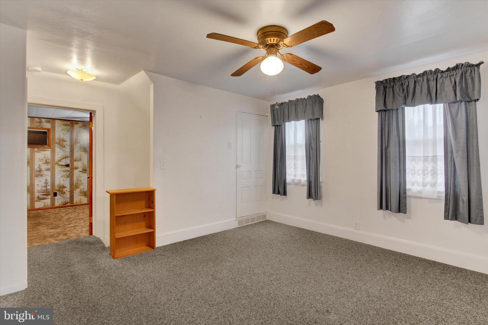 22 Cemetery Street Littlestown, PA 17340 - Photo 26 of 34 wooden floor in an empty room with a window