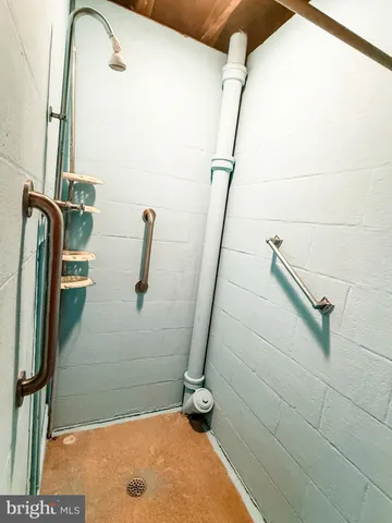a bathroom with a sink toilet and mirror
