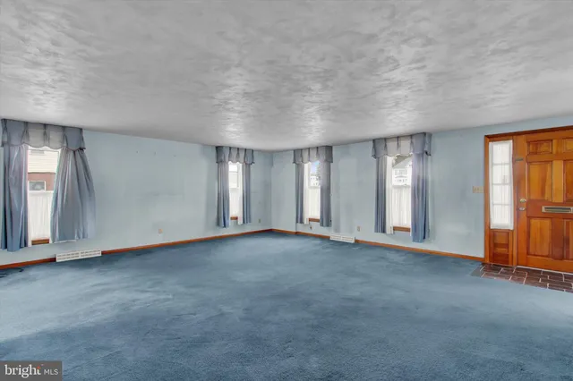 an empty room with windows
