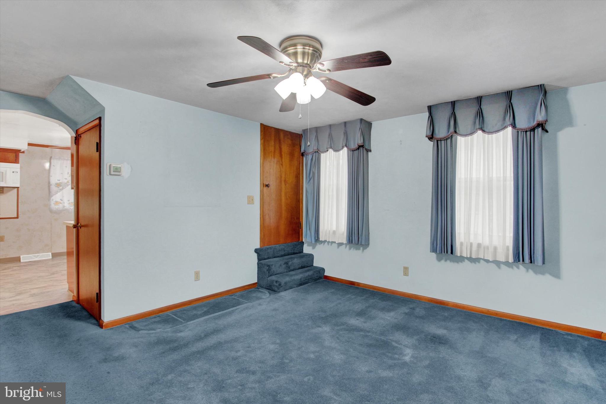 22 Cemetery Street Littlestown, PA 17340 - Photo 9 of 34 an empty room with fan and windows