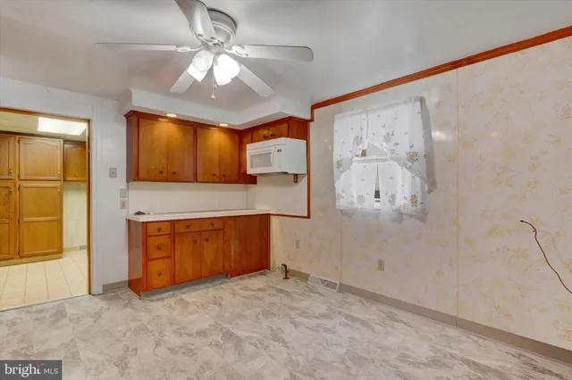 a view of a kitchen with a sink and cabinet