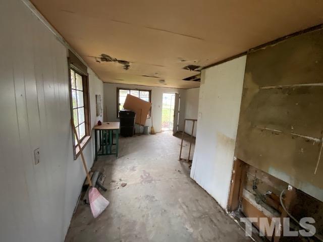 611 Jean Street Roxboro, NC 27573 - Photo 3 of 7 a view of a hallway with paintings on the wall