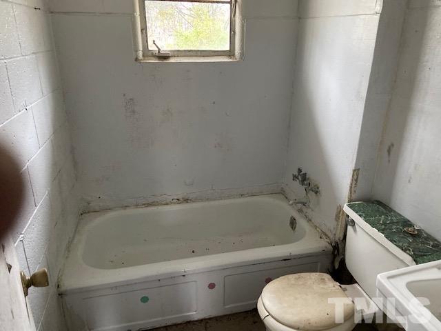 611 Jean Street Roxboro, NC 27573 - Photo 6 of 7 a white bath tub sitting next to a toilet