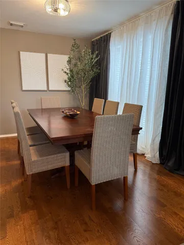 a room with a bed mirror and a window