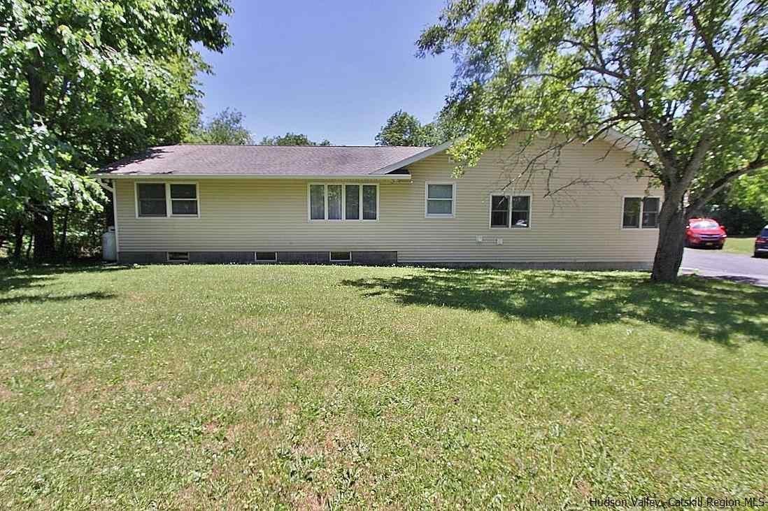 124 Blue Mountain Road Saugerties, NY 12477 - Photo 27 of 29 a front view of a house with yard and trees